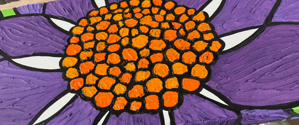 Detail — textured orange center of the dahlia